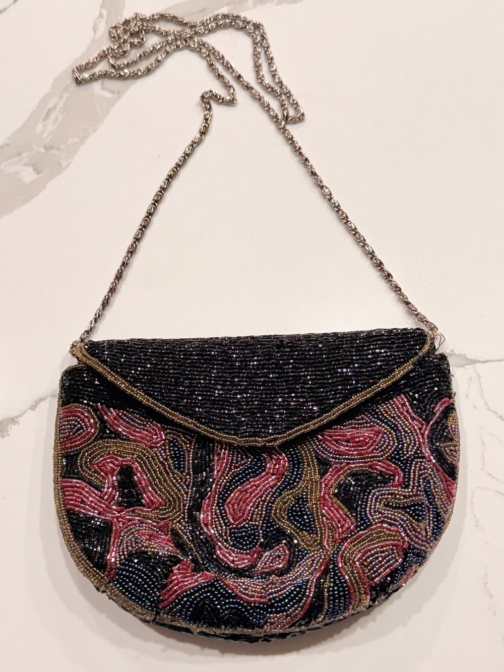 Gorgeous vintage-inspired evening bag featuring intricate hand-beaded detailing